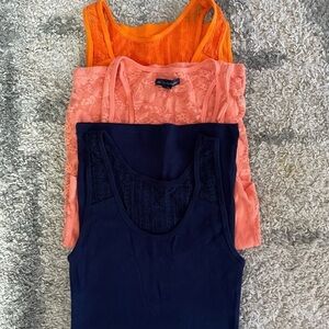 3 tank tops with open backs